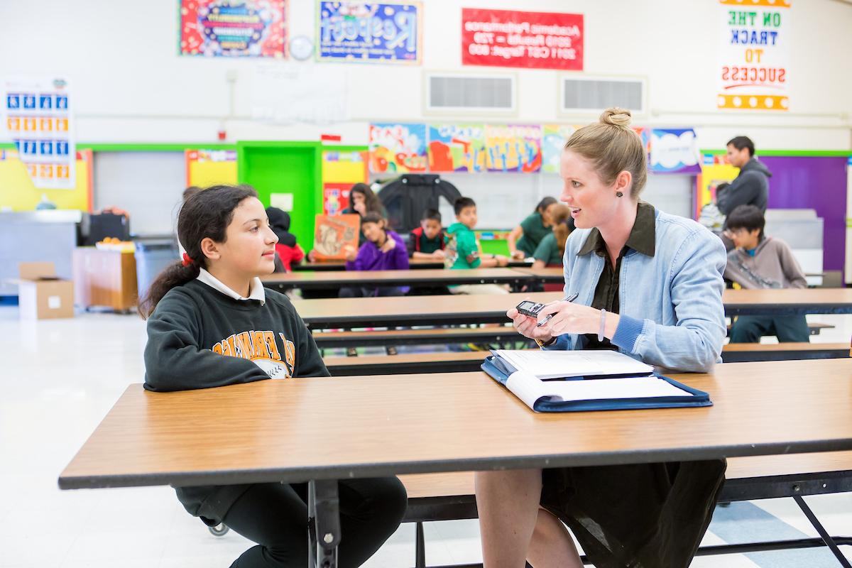 Student and Teacher speaking